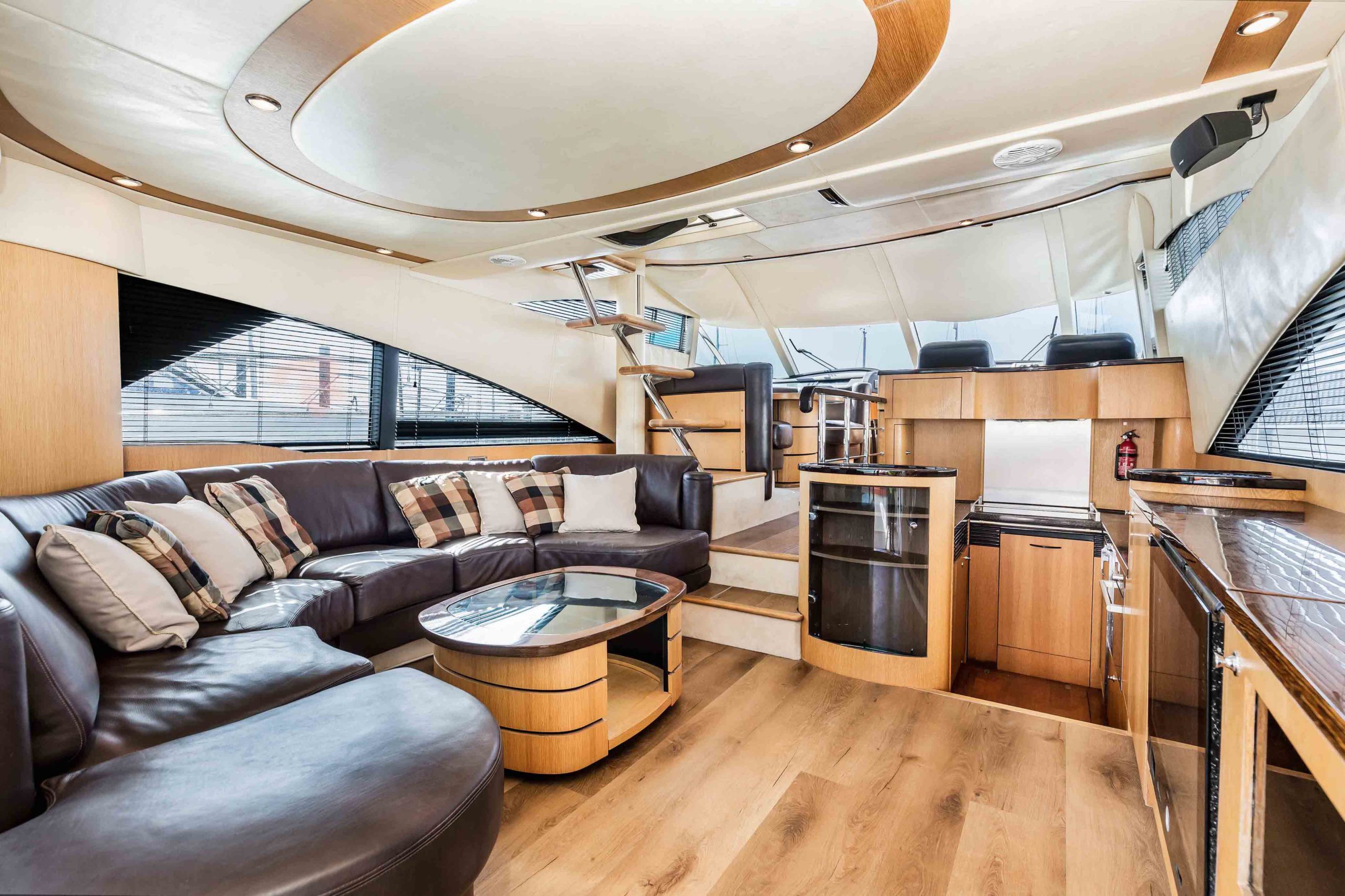 Fairline 58 saloon interior with brown sofa and tired decor