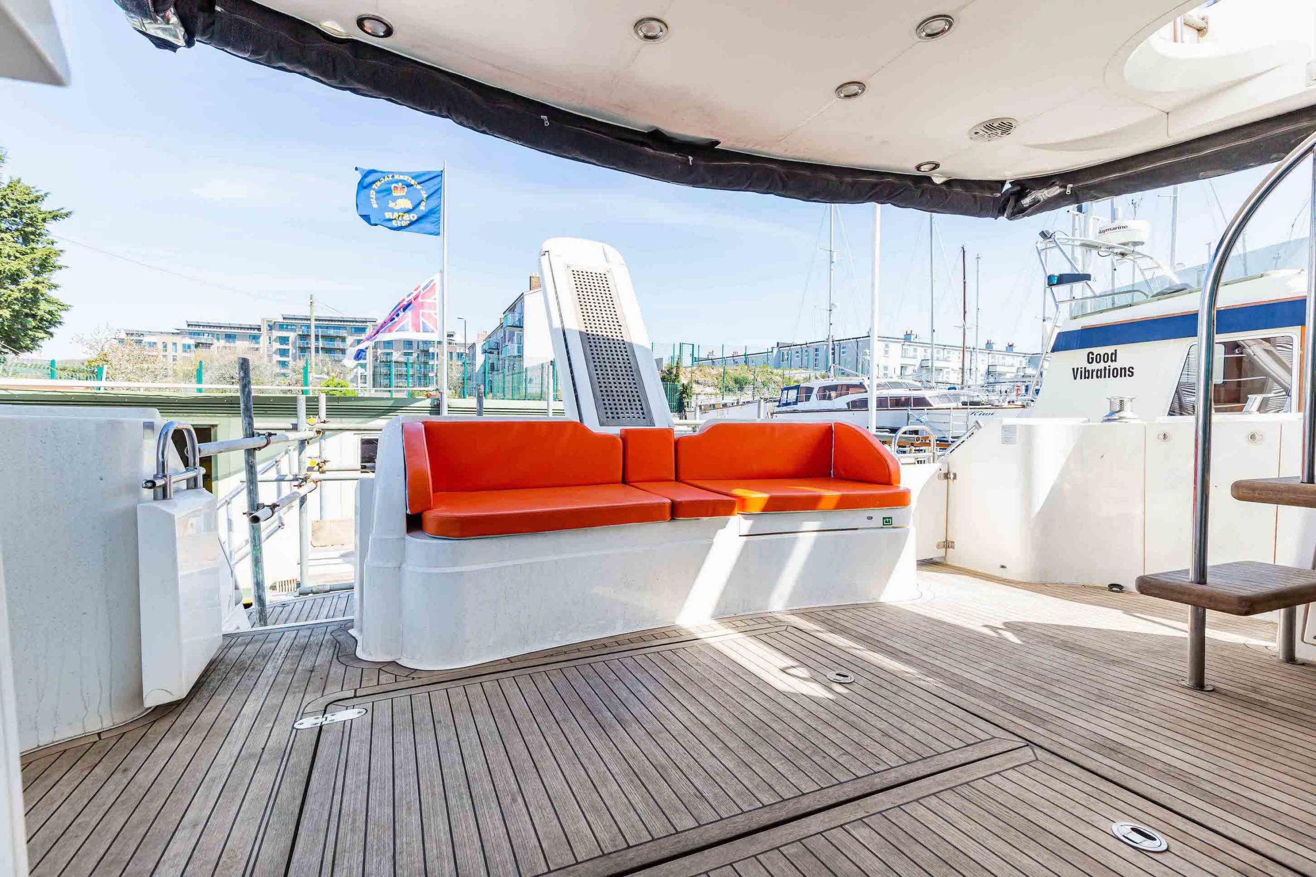 Exterior yacht sofa with orange cushions