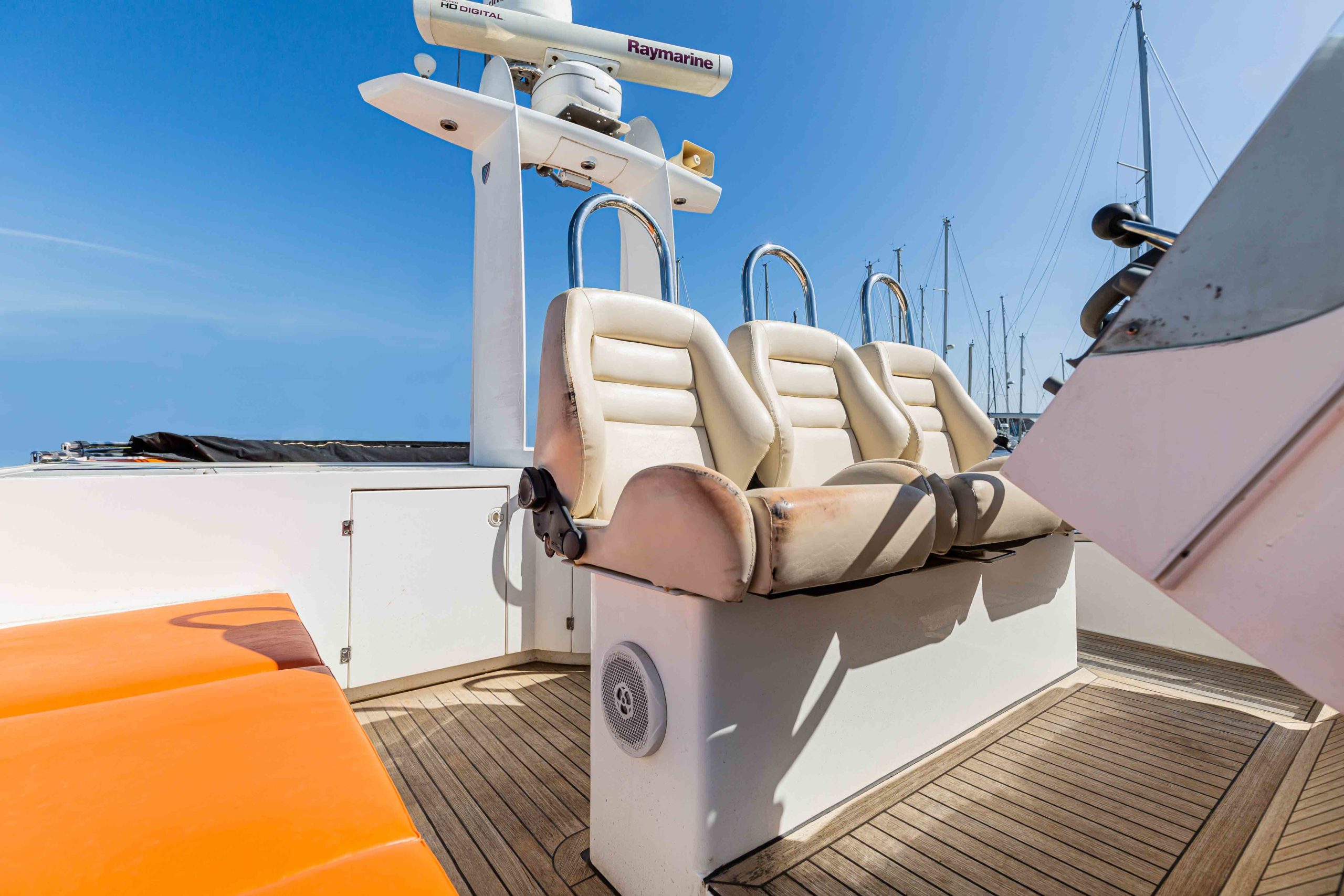 Dated exterior yacht deck with a blue sky background