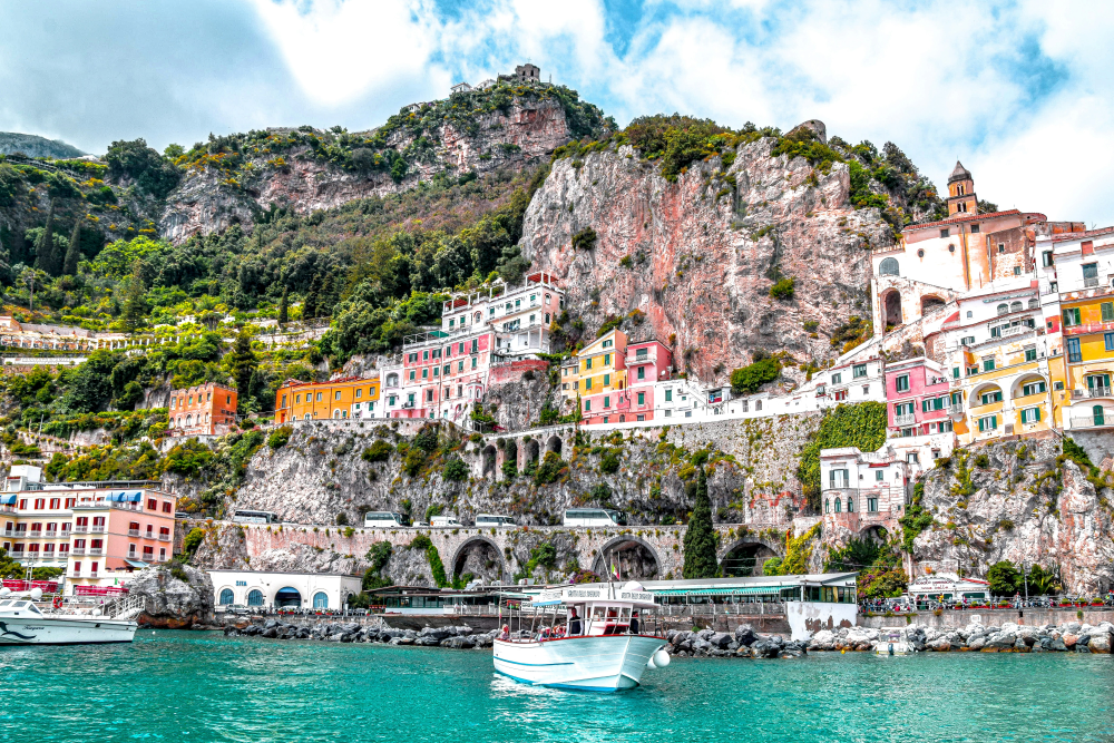 The Amalfi Coast with some boats and buildings